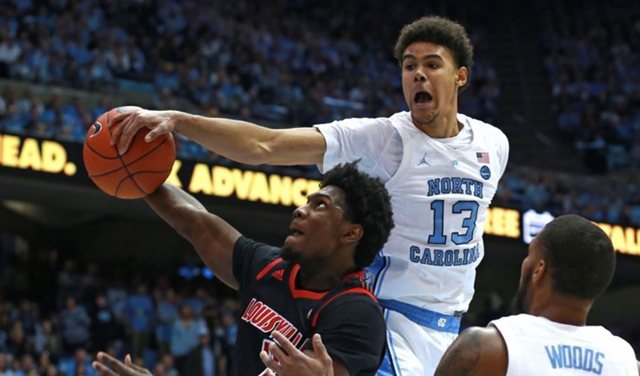 UNC's Cam Johnson gets his hand on the ball. (UNC Sports Information photo.)