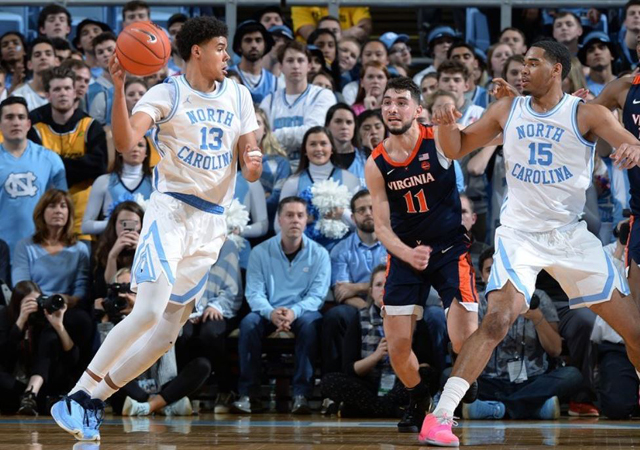 UNC's Cam Johnson, left, was injured during key minutes down the stretch. (UNC Sports Information photo.)