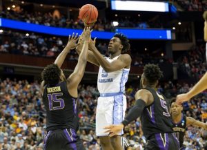 UNC's Nassir Little elevated over Washington defenders all day. (UNC Sports Information photo.)