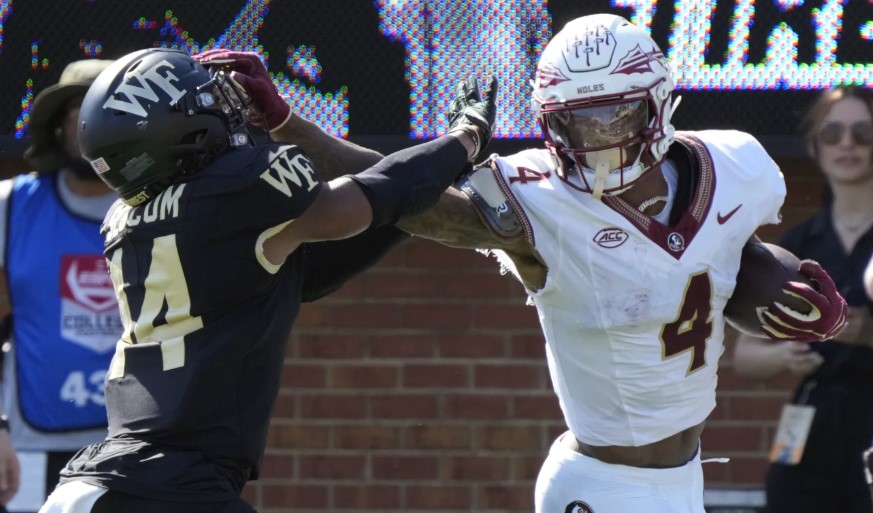 Coleman and Travis help No. 4 Florida State roll past Wake Forest FSU's Ken Coleman (4) scores.