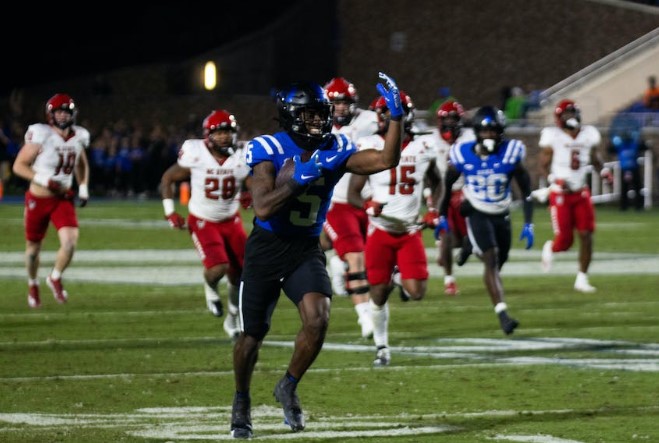 Duke football’s receiving troubles take center stage in lopsided shutout loss Jalon Calhoun runs to the end zone in Duke's win against N.C. State. Photo by Melissa Adams | The Chronicle