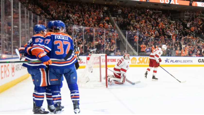 Oilers forward Warren Foegele celebrates his goal with teammates in the Hurricanes’ 6-1 loss Wednesday in Edmonton, Alberta. (Jason Franson / The Canadian Press via AP)