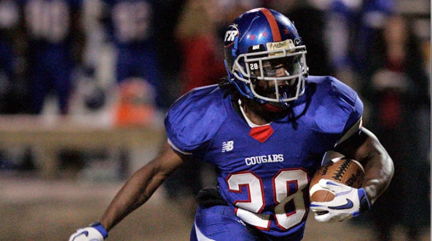 Wake Forest-Rolesville Cougars running back Casty St. Louis (28) carries the ball against the Millbrook Wildcats. Mandatory Credit: Mark Dolejs-Imagn Images | Mark Dolejs-Imagn Images © Mark Dolejs-Imagn Images