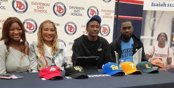 UNC Basketball Recruiting Prize Coming to Nearby Showcase Isaiah Denis and his family after announcing his commitment (Photo: Sherrell McMillan/Inside Carolina)