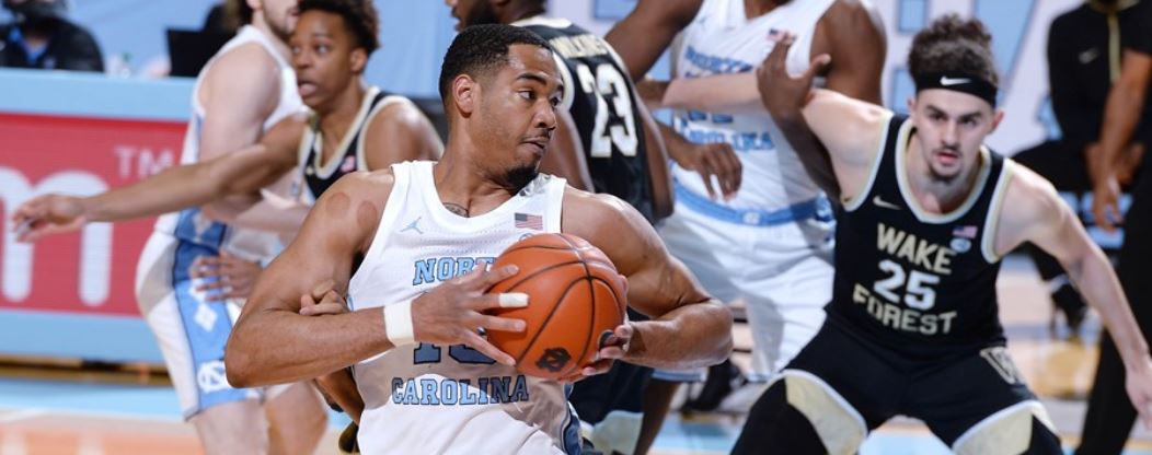 UNC's Garrison Brooks muscles in on Wake defenders. (UNC sports information photo by Jeffrey A. Camarati.)