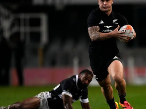 All Blacks wash away the Sharks 54-0 in rain-soaked Durban as McKenzie limps off