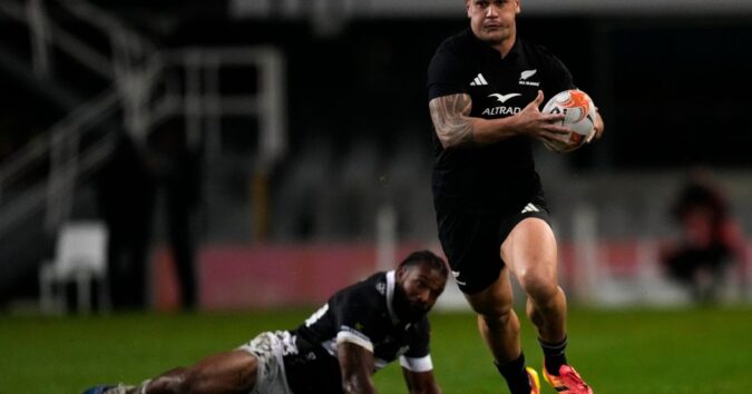All Blacks wash away the Sharks 54-0 in rain-soaked Durban as McKenzie limps off