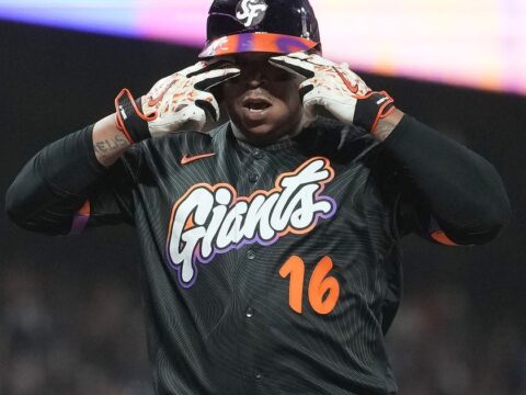 Rafael Devers bounces a homer into McCovey Cove as Giants beat Reds 3-1