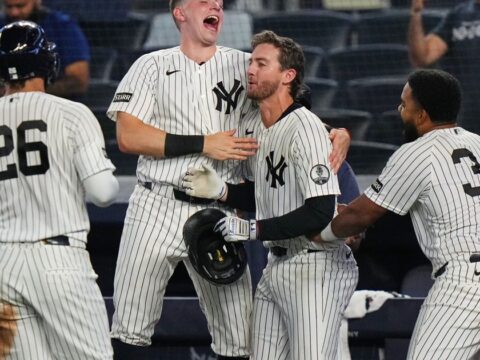 Yankees rally with 2 outs in 9th inning and beat Braves 3-2 in 10 after long rain delay Yankees rally with 2 outs in 9th inning and beat Braves 3-2 in 10 after long rain delay