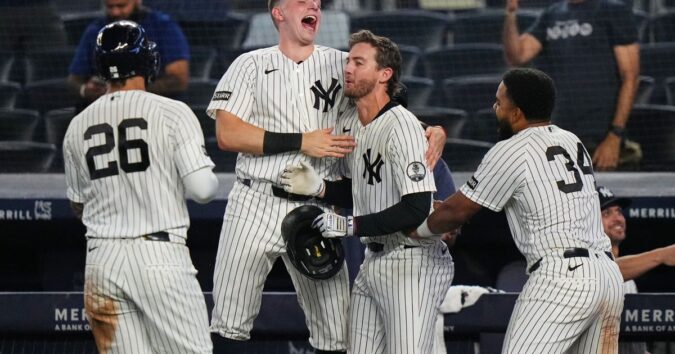 Yankees rally with 2 outs in 9th inning and beat Braves 3-2 in 10 after long rain delay Yankees rally with 2 outs in 9th inning and beat Braves 3-2 in 10 after long rain delay