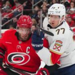 A banner heads to the rafters as the Hurricanes begin their Stanley Cup defense