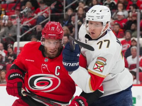 A banner heads to the rafters as the Hurricanes begin their Stanley Cup defense