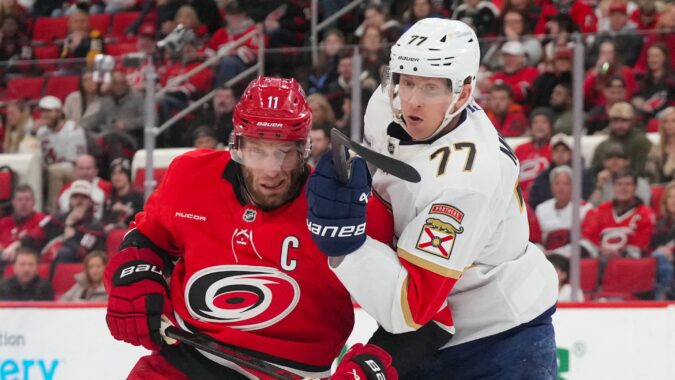 A banner heads to the rafters as the Hurricanes begin their Stanley Cup defense