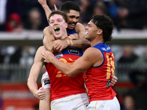A three-peat for the Brisbane Lions: a trio of Australian rules football titles in a row A three-peat for the Brisbane Lions: a trio of Australian rules football titles in a row