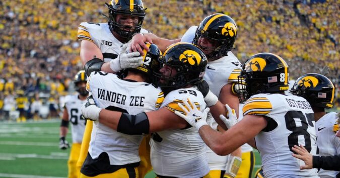 Iowa moves up to No. 14 in AP Top 25 and goes into Buckeyes showdown as possible playoff contender