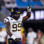 West Virginia beats No. 25 Virginia 38-27 in the Duke’s Mayo Classic