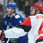 A trio of multi-goal performances help the Hurricanes win a sloppy game in Vancouver