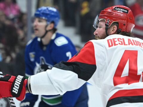 A trio of multi-goal performances help the Hurricanes win a sloppy game in Vancouver