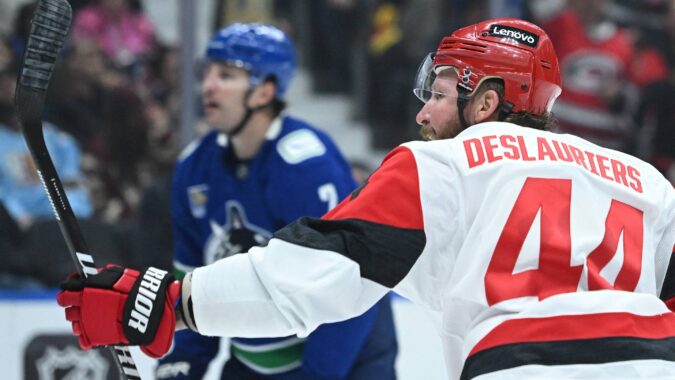 A trio of multi-goal performances help the Hurricanes win a sloppy game in Vancouver