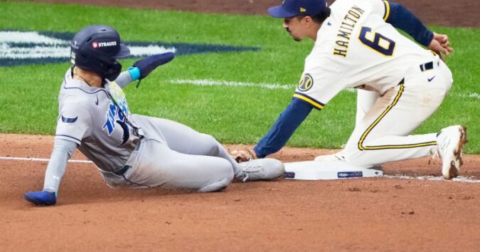 Balls glancing off gloves, runners thrown out trying to steal sink Rays in World Series opener
