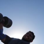 Burly men in Gaza pull trucks and flip tires in competition of strength