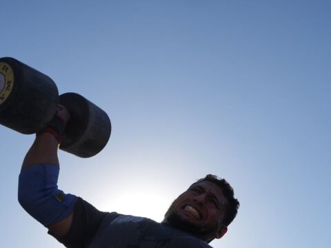 Burly men in Gaza pull trucks and flip tires in competition of strength Burly men in Gaza pull trucks and flip tires in competition of strength