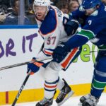 Connor McDavid has a goal and four assists as the Oilers hang on to beat the Canucks 9-7