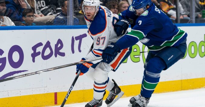 Connor McDavid has a goal and four assists as the Oilers hang on to beat the Canucks 9-7