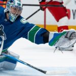 Defending champion Hurricanes beat Canucks 6-3 to take NHL lead