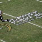 'Handshake agreement' with ESPN brings college football closer to a 24-team playoff, AP source says
