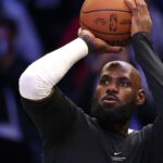 LeBron James is playing for the Philadelphia 76ers for the first time in preseason game at Brooklyn