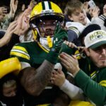 Love throws 3 TD passes as the Packers beat the Panthers 27-19