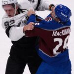 MacKinnon has 2 goals and a rare fight in the Avs' 8-4 victory over the Kings in opener