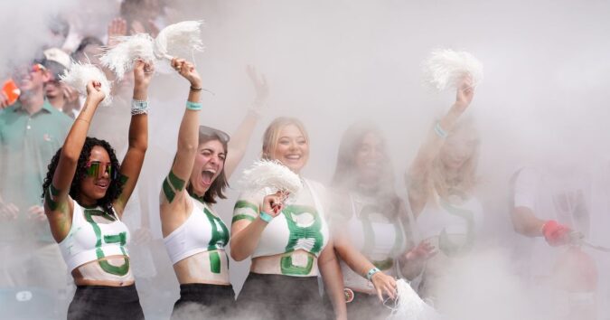No. 1 Miami, in its first game atop AP poll since 2002 season, rolls past Pitt 52-23