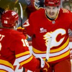 Sharangovich breaks late tie as the Flames end the Hurricanes' 7-game winning streak